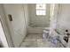 Bathroom showing new white tile surround in a remodeling project at 854 Mcdonough Se Blvd, Atlanta, GA 30315