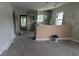 Kitchen showing unfinished cabinets with open access to the living room at 854 Mcdonough Se Blvd, Atlanta, GA 30315