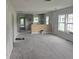 Spacious living room area featuring kitchen with light gray cabinetry in background at 854 Mcdonough Se Blvd, Atlanta, GA 30315