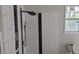 Stylish shower boasts black and white accents with a large rain shower head at 854 Mcdonough Se Blvd, Atlanta, GA 30315