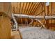 Unfinished attic with insulation, wood framing, and exposed ducts at 902 Edgewater Dr, Loganville, GA 30052
