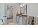 Bathroom boasts granite counters, marble floors and leads to bedroom at 902 Edgewater Dr, Loganville, GA 30052
