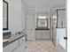 Bright bathroom with double vanity, granite counters, and glass enclosed shower at 902 Edgewater Dr, Loganville, GA 30052