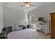 Spacious room featuring ceiling fan, carpeted floors, and ample space for various types of equipment at 902 Edgewater Dr, Loganville, GA 30052