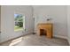 Bright bedroom with hardwood floors, a vintage desk, and a large window offering natural light at 902 Edgewater Dr, Loganville, GA 30052