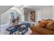 Large bonus room with comfy seating, large rug and desk area at 902 Edgewater Dr, Loganville, GA 30052