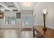 Elegant foyer featuring hardwood floors, coffered ceilings, and a stylish console table with decorative lamp at 902 Edgewater Dr, Loganville, GA 30052