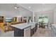 Open concept living area featuring kitchen with island with bar seating, stainless appliances at 902 Edgewater Dr, Loganville, GA 30052