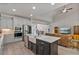 Modern kitchen with granite countertops, stainless appliances and an open concept layout to the living area at 902 Edgewater Dr, Loganville, GA 30052
