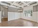 Bright room featuring a coffered ceiling, modern light fixture, and large window, creating a welcoming space at 902 Edgewater Dr, Loganville, GA 30052