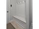 Mudroom with built-in bench seating and convenient coat hooks for organization at 902 Edgewater Dr, Loganville, GA 30052