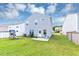 Well-maintained backyard with lush grass, play set, and white picket fence perfect for outdoor enjoyment at 109 Paulownia Cir, Mcdonough, GA 30253