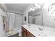 Well-lit bathroom featuring double sinks, framed mirrors, and a shower-tub combo, perfect for busy mornings at 109 Paulownia Cir, Mcdonough, GA 30253