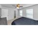 Comfortable bedroom with neutral walls, a ceiling fan, and a view of a nearby closet at 109 Paulownia Cir, Mcdonough, GA 30253