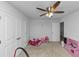 Bright bedroom with a ceiling fan, ample closet space and plenty of room to play at 109 Paulownia Cir, Mcdonough, GA 30253