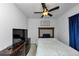 Bedroom featuring plush carpet, ceiling fan, dark curtains, and a modern dresser and bed at 109 Paulownia Cir, Mcdonough, GA 30253