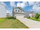 Exterior view of a two-story home with a garage and driveway with a lawn at 109 Paulownia Cir, Mcdonough, GA 30253