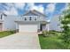 Inviting two-story home showcases an attached two car garage, complemented by fresh landscaping and a concrete driveway at 109 Paulownia Cir, Mcdonough, GA 30253