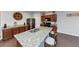 Kitchen featuring granite counters, wood cabinets, stainless appliances, and breakfast bar at 109 Paulownia Cir, Mcdonough, GA 30253