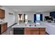 Kitchen island features granite countertops with sink and a stainless-steel dishwasher at 109 Paulownia Cir, Mcdonough, GA 30253