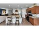 Spacious open concept kitchen boasts a granite island, stainless appliances and wooden cabinets at 109 Paulownia Cir, Mcdonough, GA 30253