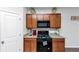 Kitchen area with granite countertops, stainless appliances, and wood cabinets at 109 Paulownia Cir, Mcdonough, GA 30253