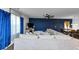 Spacious living room boasts a large sofa and accent wall with natural lighting at 109 Paulownia Cir, Mcdonough, GA 30253
