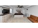 Spacious primary bedroom with tray ceiling, ceiling fan, and walk-in closet offers a calming retreat at 109 Paulownia Cir, Mcdonough, GA 30253