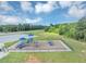 Aerial view of a community playground featuring slides and climbing structures in a fenced area at 109 Paulownia Cir, Mcdonough, GA 30253