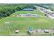 Aerial view of recreational area featuring soccer fields, a concession stand, and a covered sports area at 109 Paulownia Cir, Mcdonough, GA 30253