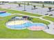 Aerial shot of a colorful splash pad at a community park, surrounded by green space at 109 Paulownia Cir, Mcdonough, GA 30253