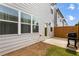 Cozy backyard featuring a grill and wood fence, perfect for outdoor entertaining at 319 Hayden Cir, Woodstock, GA 30189
