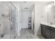 Modern bathroom with a glass-enclosed shower, gray tile flooring, and a contemporary vanity at 319 Hayden Cir, Woodstock, GA 30189