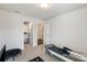 Neutral bonus room featuring a small closet and exercise equipment on a light carpeted floor at 319 Hayden Cir, Woodstock, GA 30189