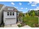 Charming two-story home featuring a one-car garage, a cozy balcony, and a well-manicured lawn at 319 Hayden Cir, Woodstock, GA 30189