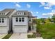 Charming two-story home featuring a one-car garage, a cozy balcony, and a well-manicured lawn at 319 Hayden Cir, Woodstock, GA 30189