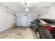 Spacious garage featuring a car, ample storage shelves, and a sturdy door at 319 Hayden Cir, Woodstock, GA 30189