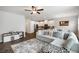 Inviting living room featuring a comfortable sectional sofa, stylish rug, and bright, open layout at 319 Hayden Cir, Woodstock, GA 30189
