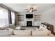 Cozy living room featuring a fireplace, built-in shelves, and comfortable seating at 319 Hayden Cir, Woodstock, GA 30189