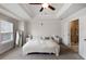 Main bedroom with ensuite bathroom access, neutral colors, and a large window for ample light at 319 Hayden Cir, Woodstock, GA 30189