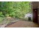 Back deck overlooking wooded area, offering privacy. Backyard has a detached garage at 4039 Tanglewood Rd, Snellville, GA 30039
