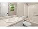 Bathroom featuring a sink, toilet, and shower/tub combo at 4039 Tanglewood Rd, Snellville, GA 30039