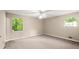 Bedroom featuring carpeted floors and natural light with a ceiling fan at 4039 Tanglewood Rd, Snellville, GA 30039