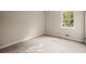 Cozy bedroom with carpet flooring and a window offering natural light at 4039 Tanglewood Rd, Snellville, GA 30039