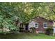Beautiful home featuring stone details and front yard greenery at 4039 Tanglewood Rd, Snellville, GA 30039