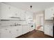 Clean kitchen features bright white cabinets and a gas range at 4039 Tanglewood Rd, Snellville, GA 30039