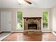 Living room with hardwood floors, stone fireplace and good light at 4039 Tanglewood Rd, Snellville, GA 30039