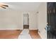 Open concept living room with hardwood flooring, neutral paint, and lots of natural light at 4039 Tanglewood Rd, Snellville, GA 30039