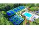 Aerial view showcasing the community pool, clubhouse, and multiple tennis courts at 1635 Lake Heights Cir, Dacula, GA 30019