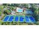 Stunning aerial view of the community pool, clubhouse, tennis courts, and manicured grounds at 1635 Lake Heights Cir, Dacula, GA 30019
